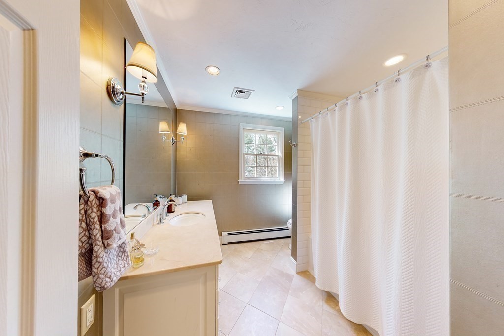 1 Chestnut Lane Medfield, MA 02052 - Photo 24 of 39 a bathroom with a sink vanity and a mirror