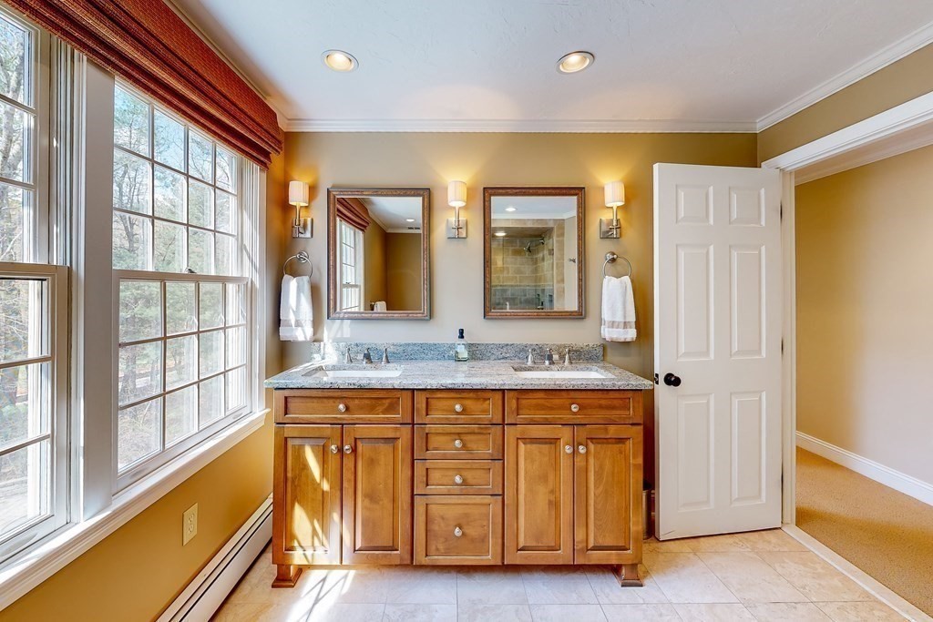 1 Chestnut Lane Medfield, MA 02052 - Photo 27 of 39 a bathroom with a granite countertop sink and a bathtub