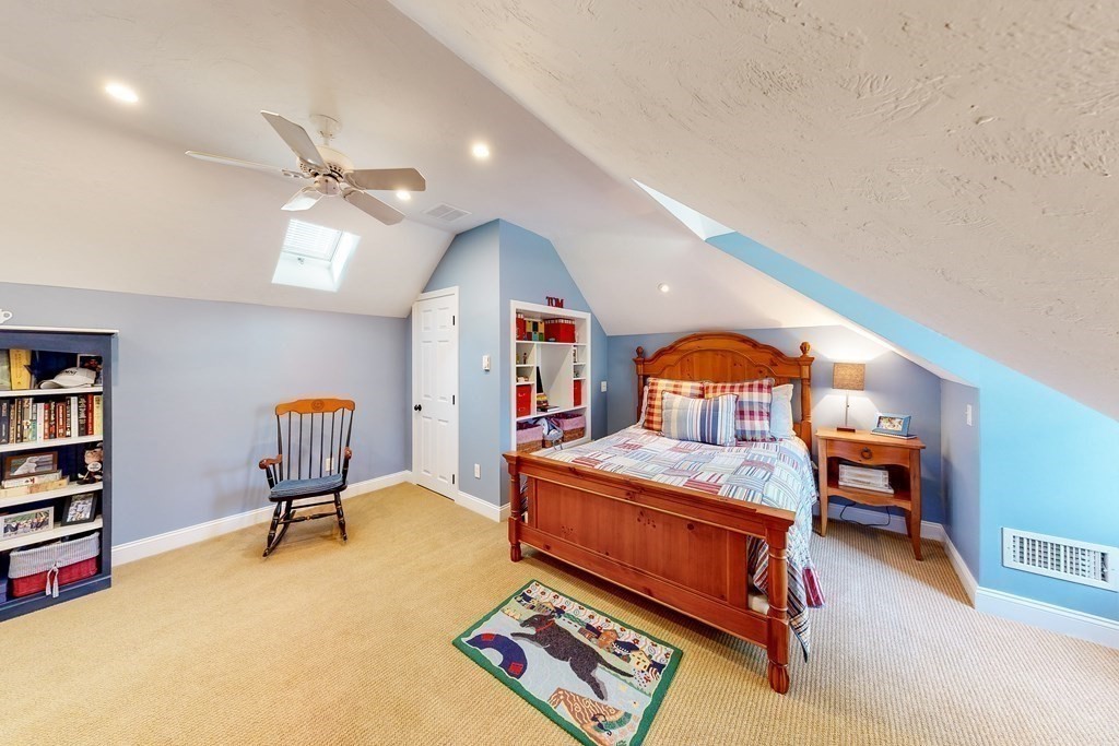 1 Chestnut Lane Medfield, MA 02052 - Photo 28 of 39 a bedroom with furniture and a chandelier