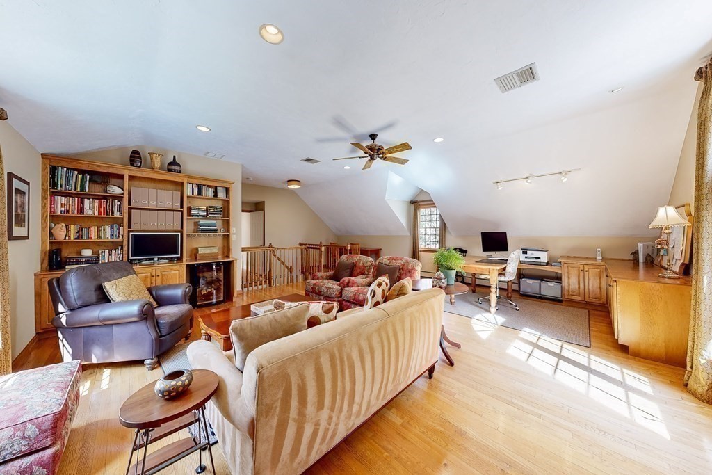 1 Chestnut Lane Medfield, MA 02052 - Photo 29 of 39 a living room with furniture and a chandelier