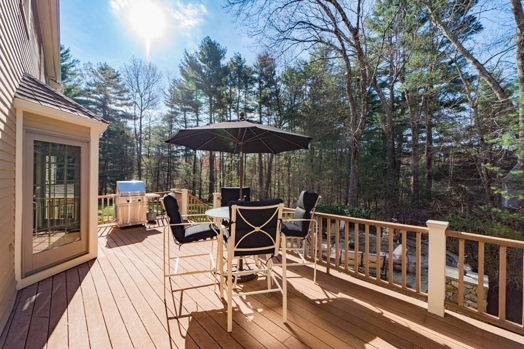 1 Chestnut Lane Medfield, MA 02052 - Photo 35 of 39 a view of a patio with wooden floor and iron fence