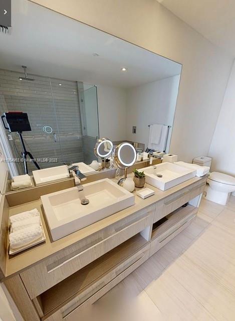 4010 South Ocean Drive, Unit R2305 Hollywood, FL 33019 - Photo 11 of 15 a bathroom with a sink and a mirror