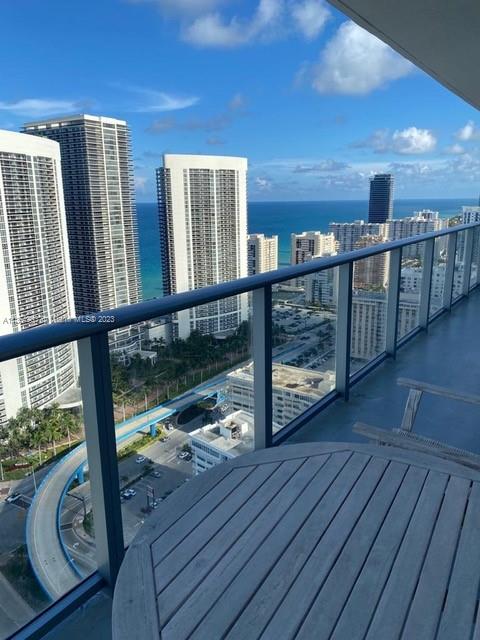 4010 South Ocean Drive, Unit R2305 Hollywood, FL 33019 - Photo 12 of 15 a view of a balcony with wooden floor