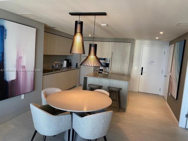 4010 South Ocean Drive, Unit R2305 Hollywood, FL 33019 - Photo 14 of 15 a dining room with furniture and window