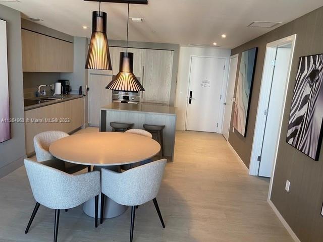4010 South Ocean Drive, Unit R2305 Hollywood, FL 33019 - Photo 15 of 15 a dining room with furniture and window