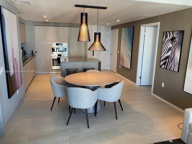 4010 South Ocean Drive, Unit R2305 Hollywood, FL 33019 - Photo 8 of 15 a view of a dining room with furniture