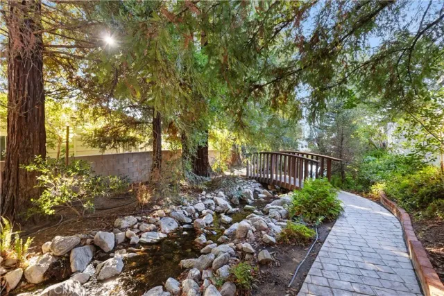 a view of a pathway with a wrought fence