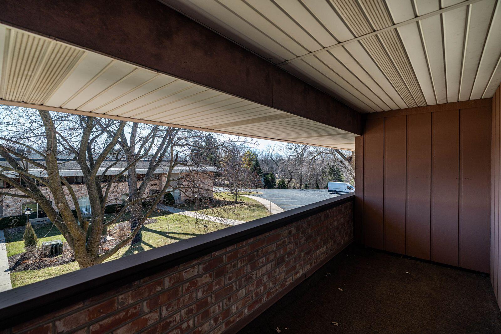11936 West Mill Road, Unit 9 Milwaukee, WI 53225 - Photo 19 of 36 Primary Bedroom Balcony