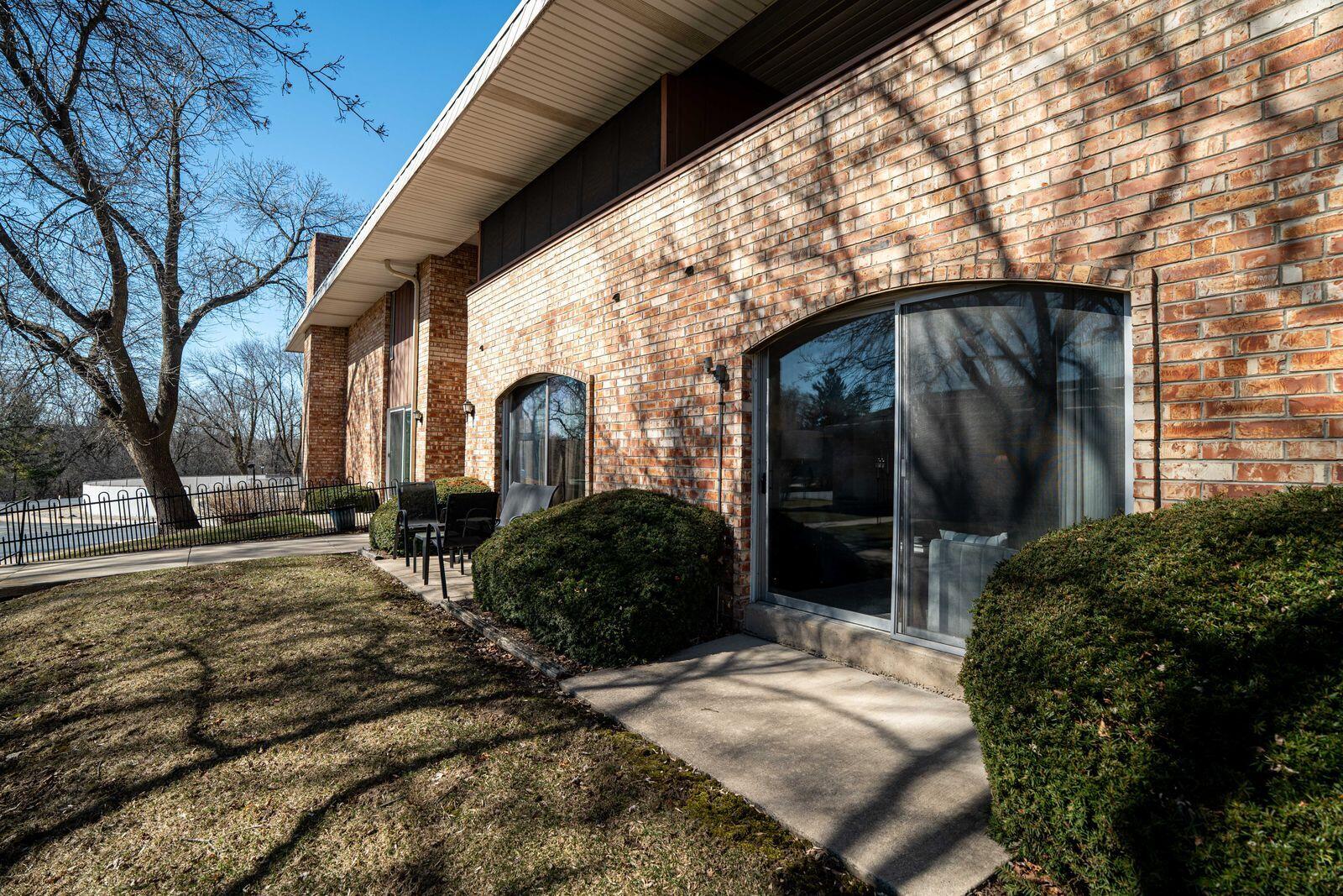 11936 West Mill Road, Unit 9 Milwaukee, WI 53225 - Photo 27 of 36 Patio Outside of Living Room