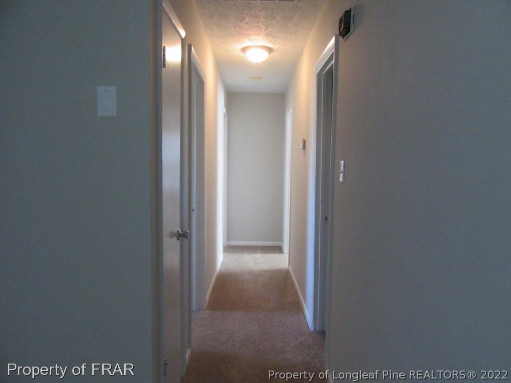 5947 Spinner Road Hope Mills, NC 28348 - Photo 16 of 31 a view of a hallway
