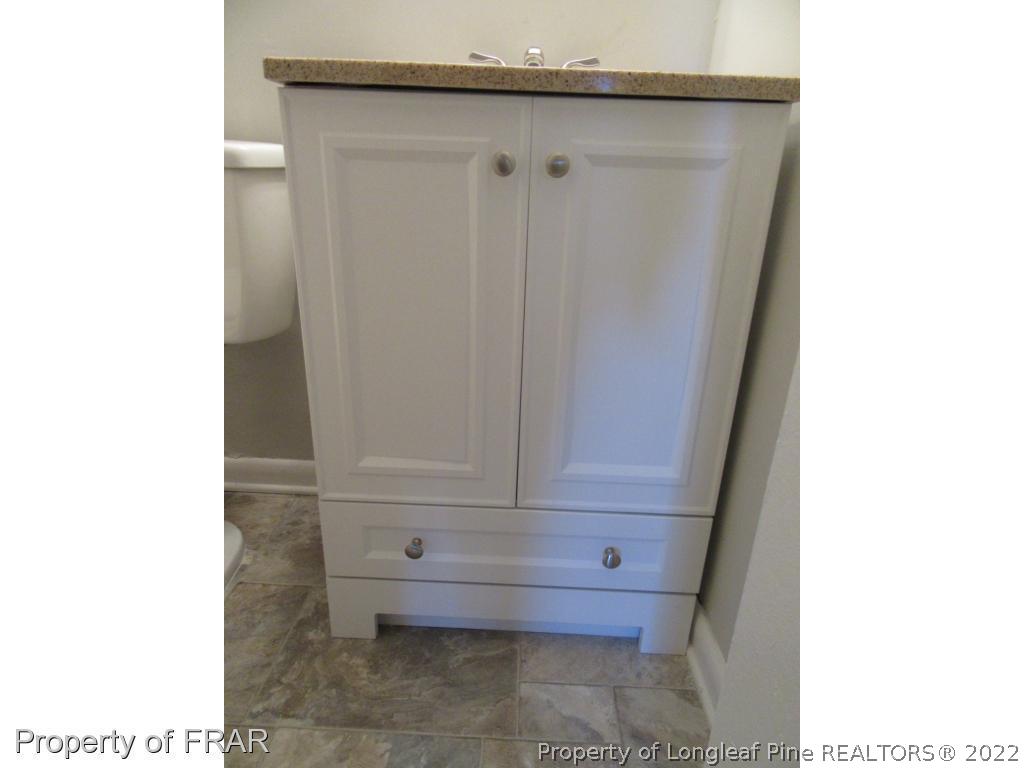 5947 Spinner Road Hope Mills, NC 28348 - Photo 19 of 31 a bathroom with a bathtub