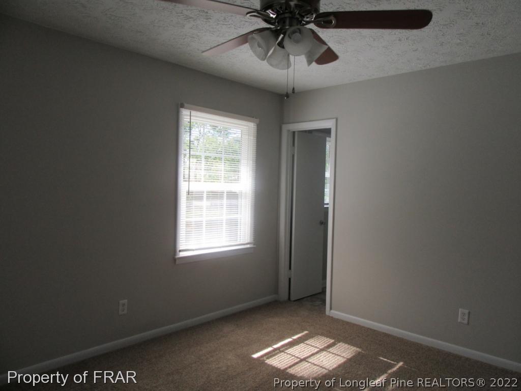 5947 Spinner Road Hope Mills, NC 28348 - Photo 22 of 31 an empty room with a window