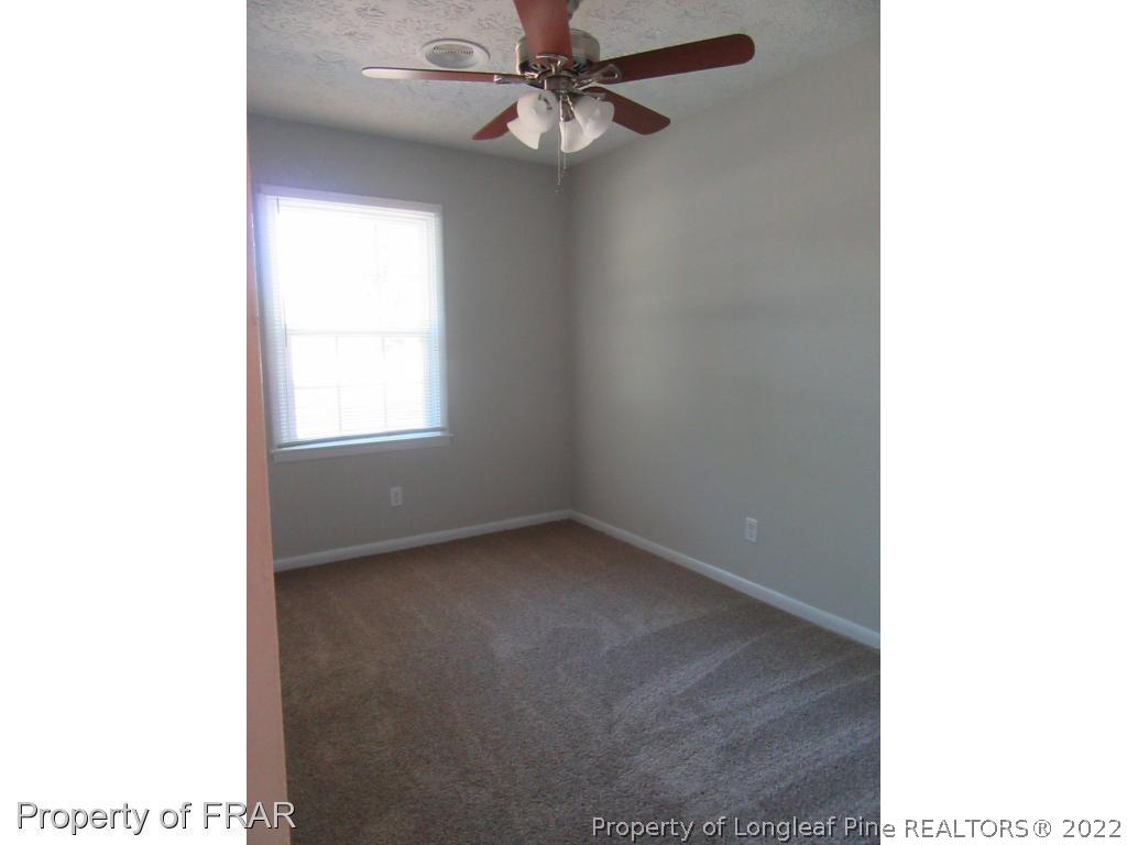 5947 Spinner Road Hope Mills, NC 28348 - Photo 28 of 31 a view of an empty room with a window