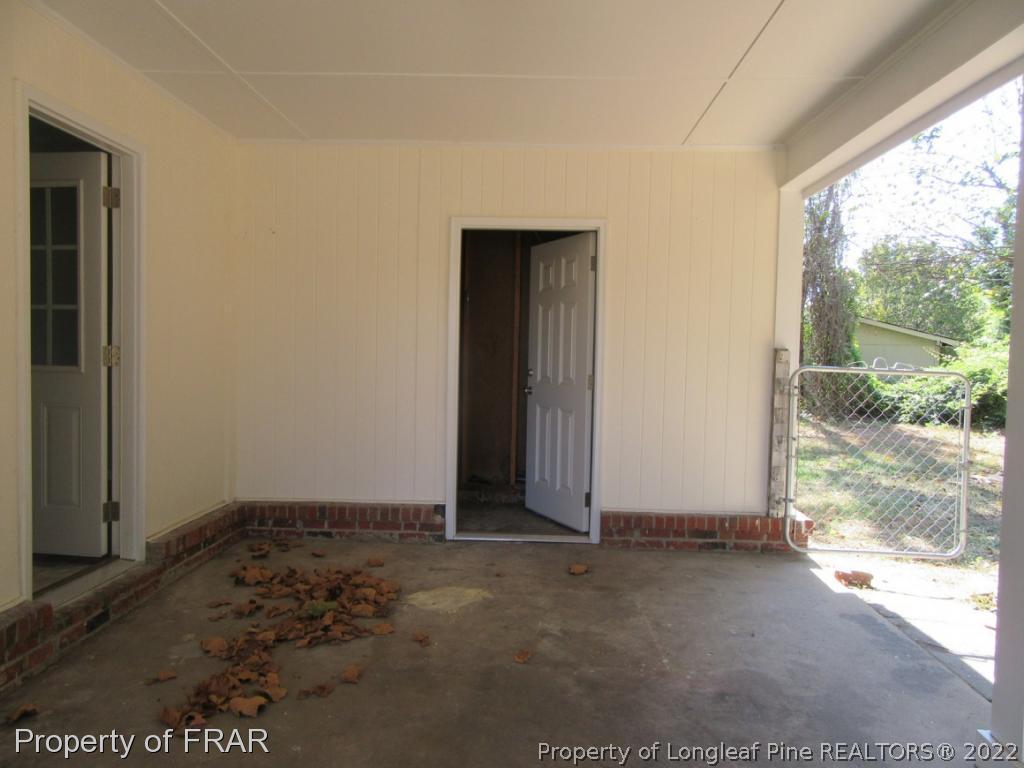 5947 Spinner Road Hope Mills, NC 28348 - Photo 30 of 31 an empty room with large windows