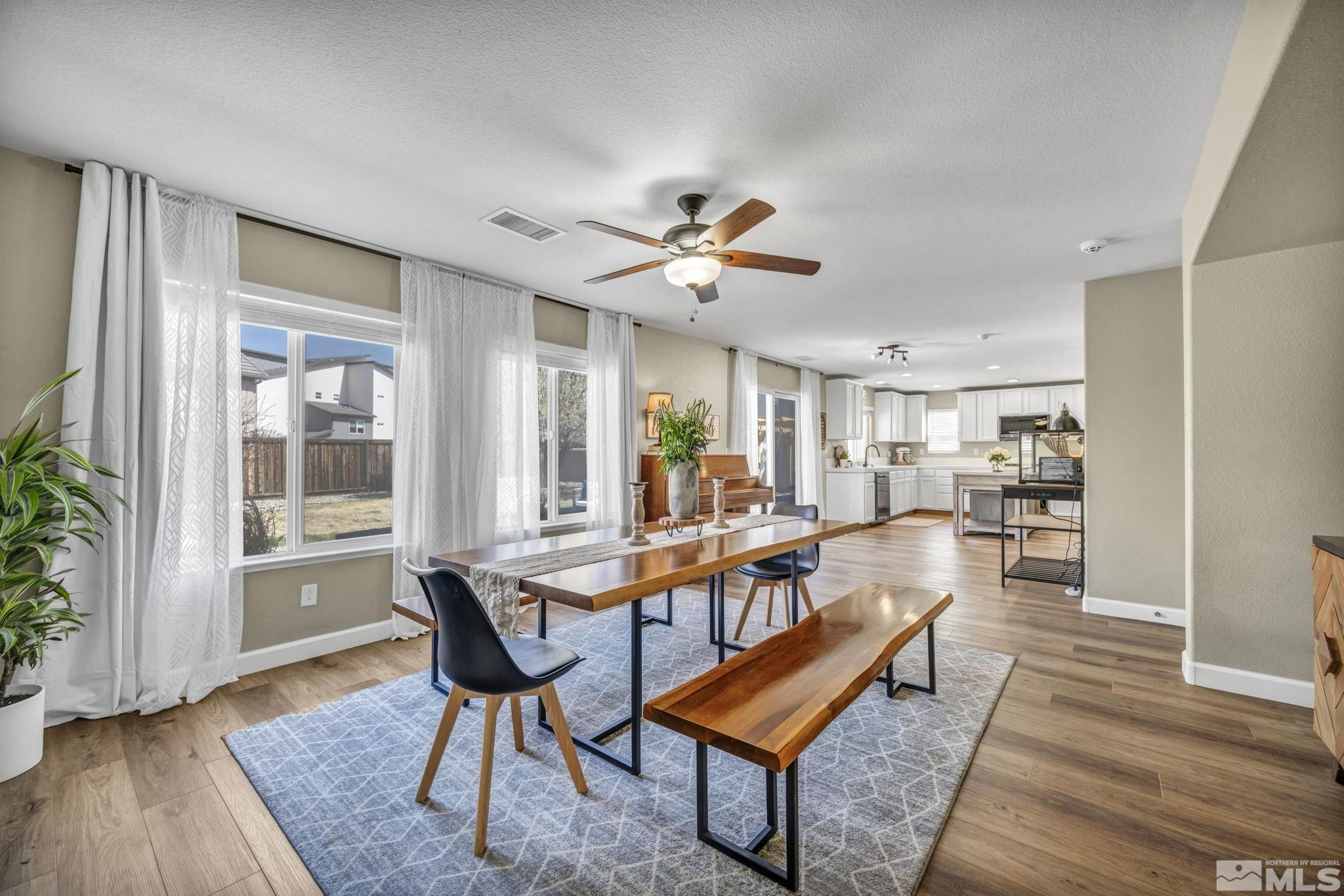 485 Sondrio Court Reno, NV 89521 - Photo 13 of 40 a living room with furniture a table and a large window