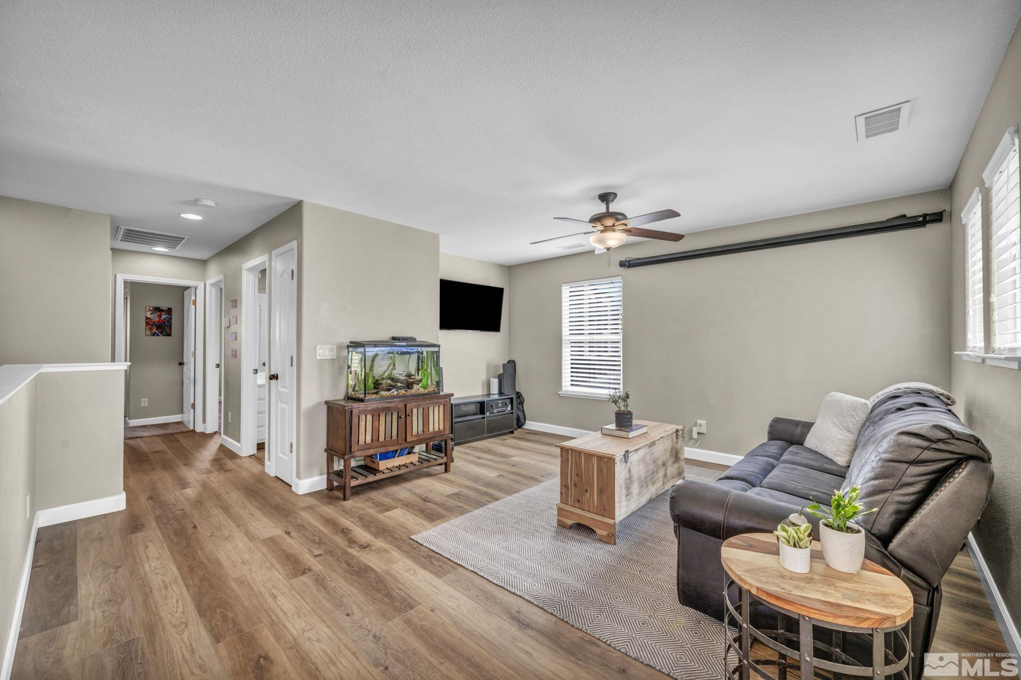 485 Sondrio Court Reno, NV 89521 - Photo 16 of 40 a living room with furniture and a wooden floor