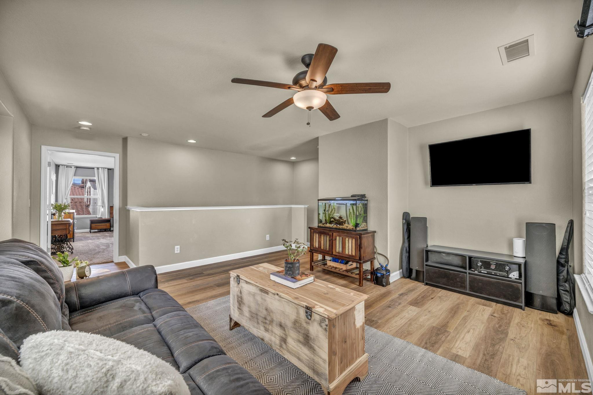 485 Sondrio Court Reno, NV 89521 - Photo 17 of 40 a living room with furniture and a flat screen tv