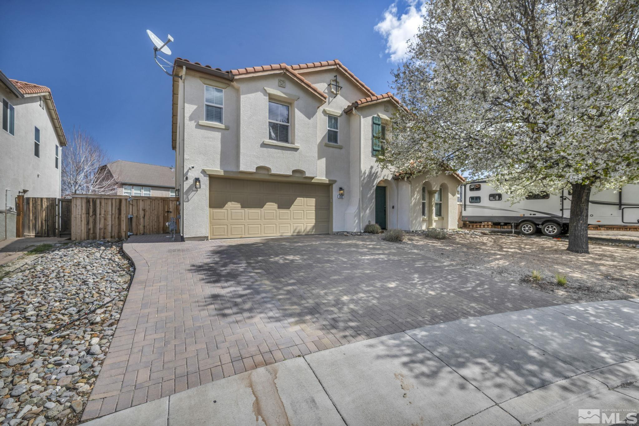 485 Sondrio Court Reno, NV 89521 - Photo 2 of 40 a front view of a house with a yard