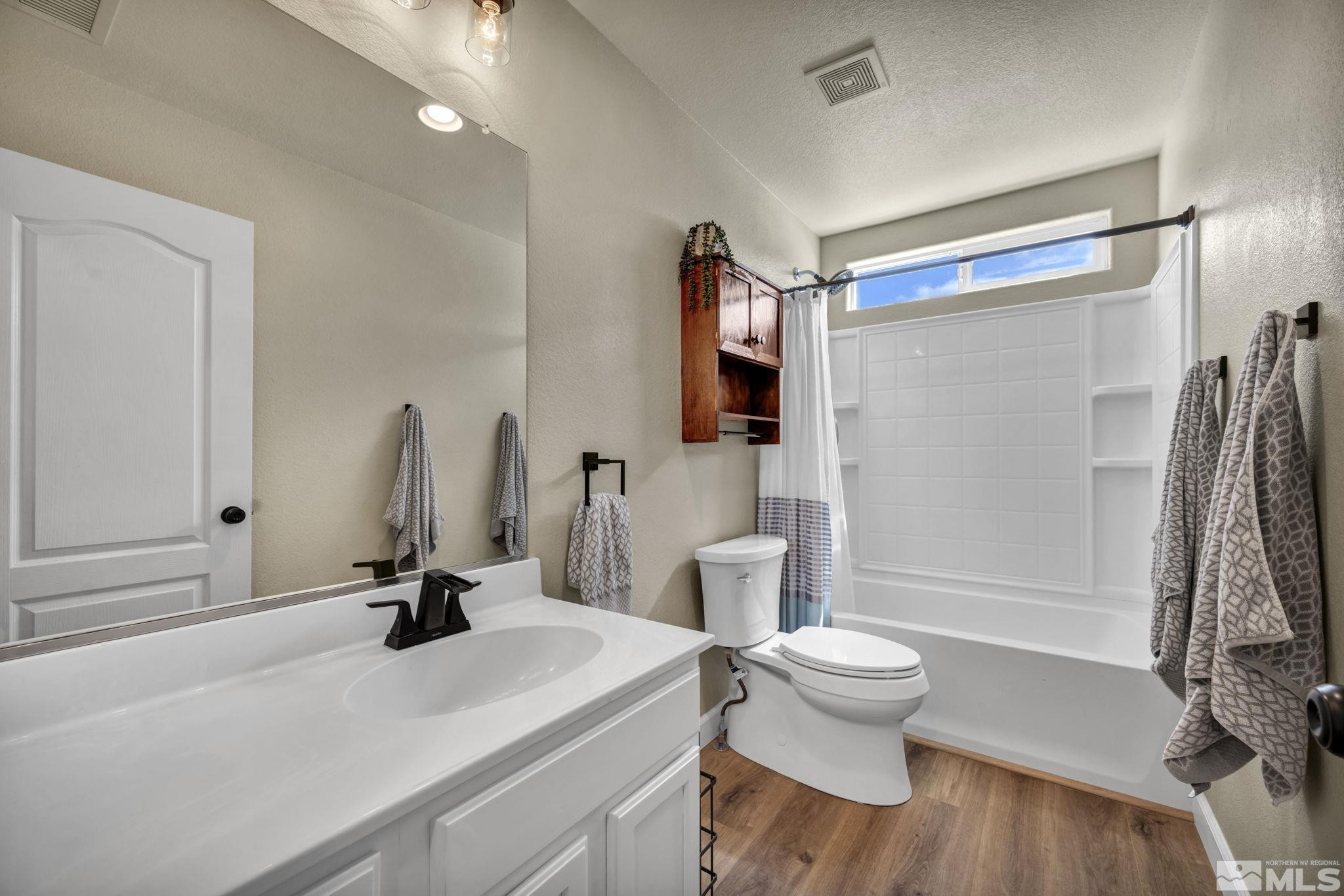 485 Sondrio Court Reno, NV 89521 - Photo 25 of 40 a bathroom with a sink toilet and shower