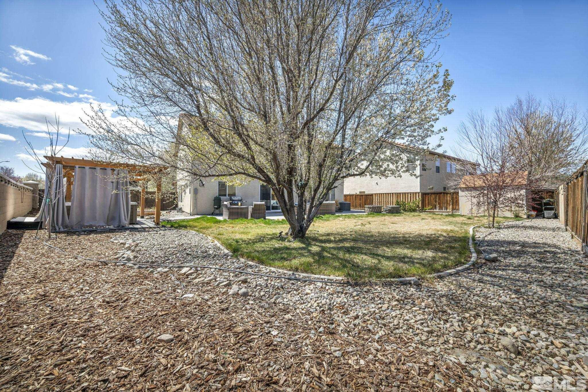 485 Sondrio Court Reno, NV 89521 - Photo 29 of 40 a view of a yard with a house