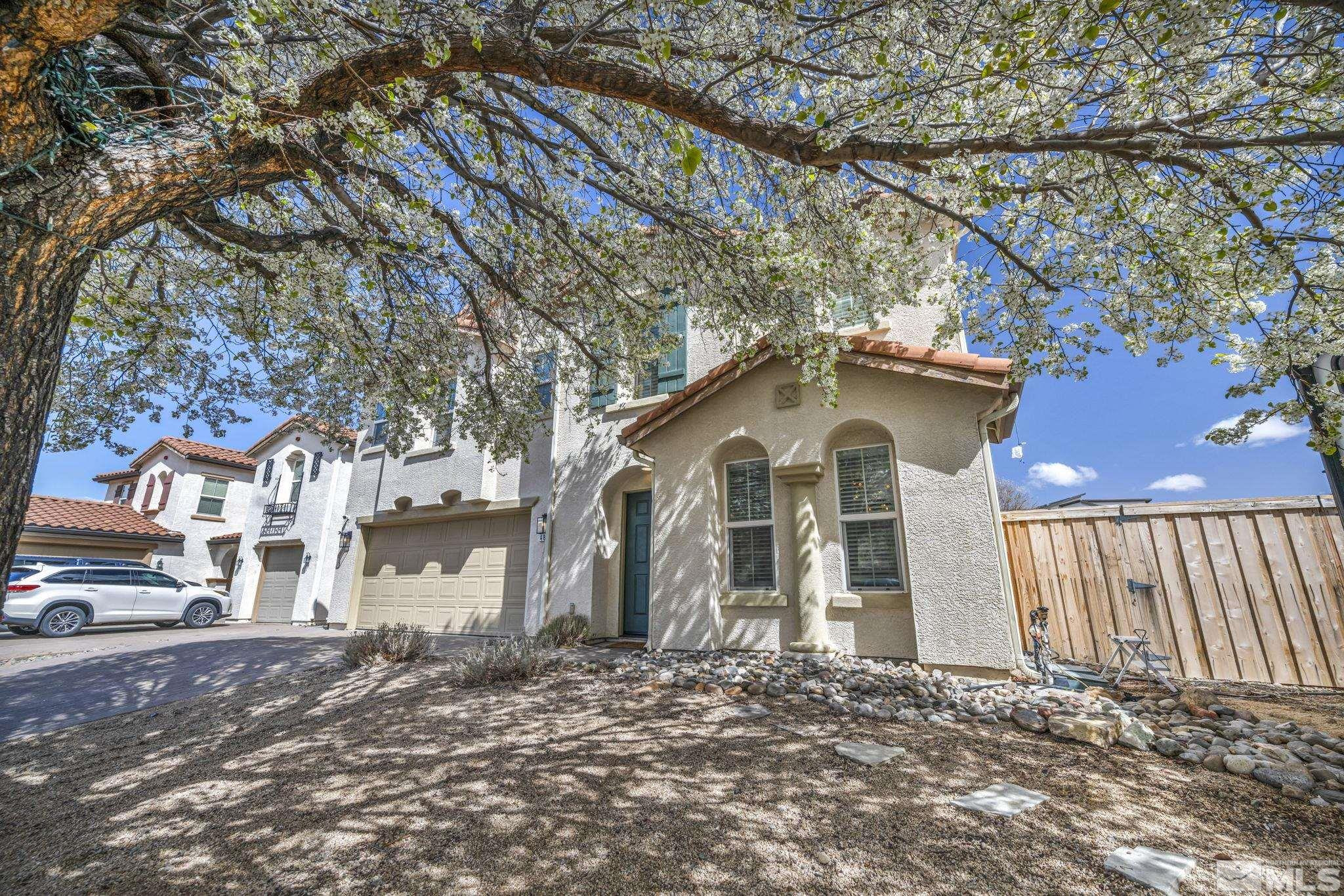 485 Sondrio Court Reno, NV 89521 - Photo 4 of 40 a view of a house with a yard