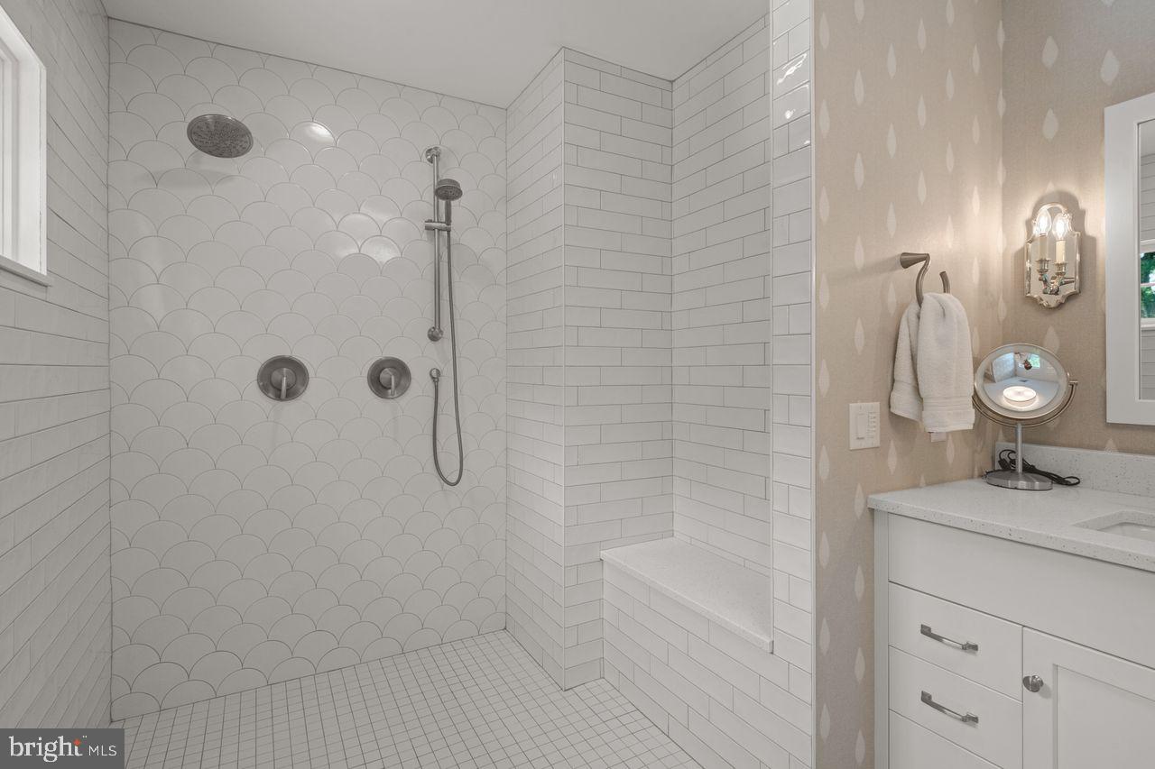 121 Eshelman Road Lancaster, PA 17601 - Photo 45 of 98 a bathroom with a shower a sink and mirror