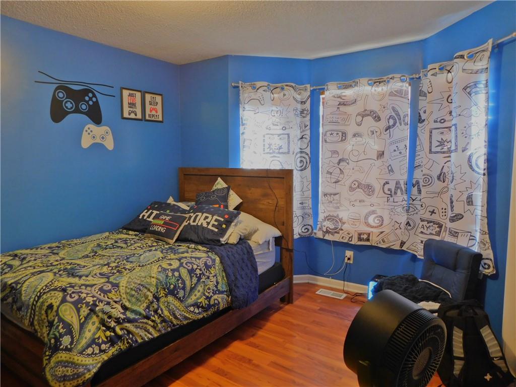 419 Rail Overlook Adairsville, GA 30103 - Photo 7 of 17 a bedroom with a bed and a couch