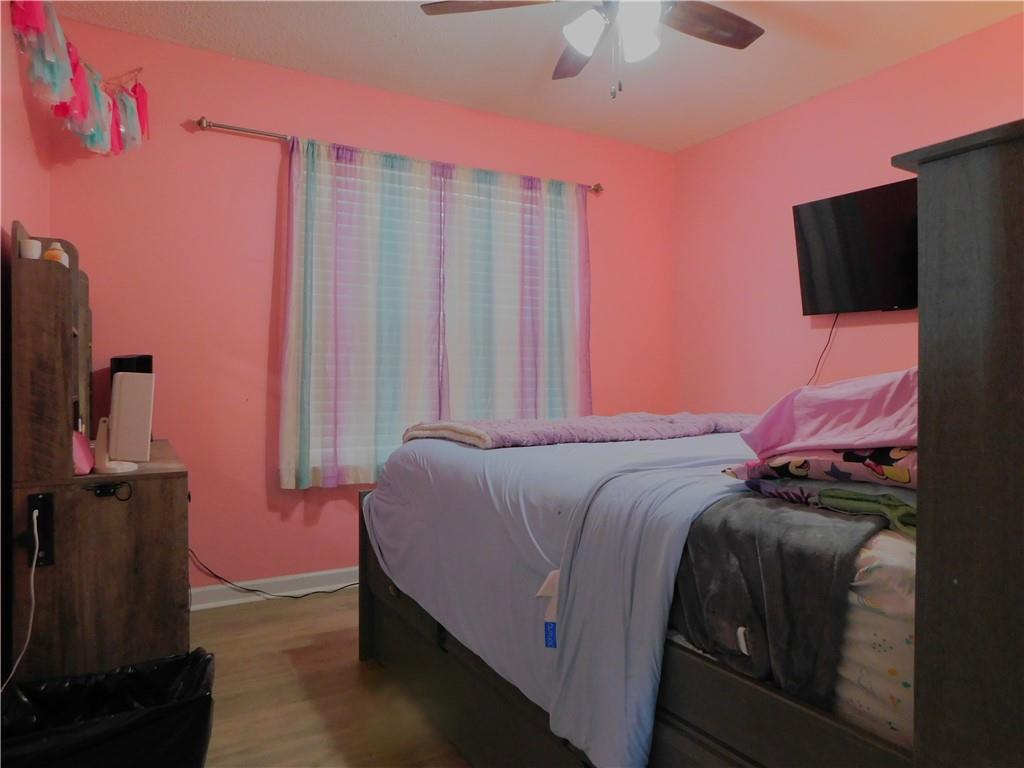 419 Rail Overlook Adairsville, GA 30103 - Photo 8 of 17 a bed room with a bed window and a flat screen tv