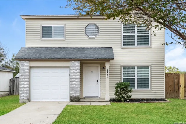 a front view of house with yard