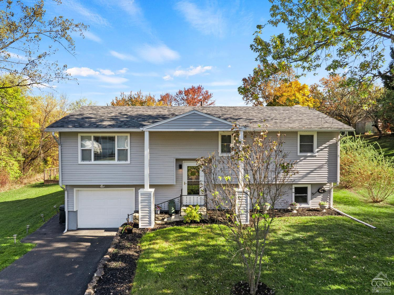 front view of a house with a yard