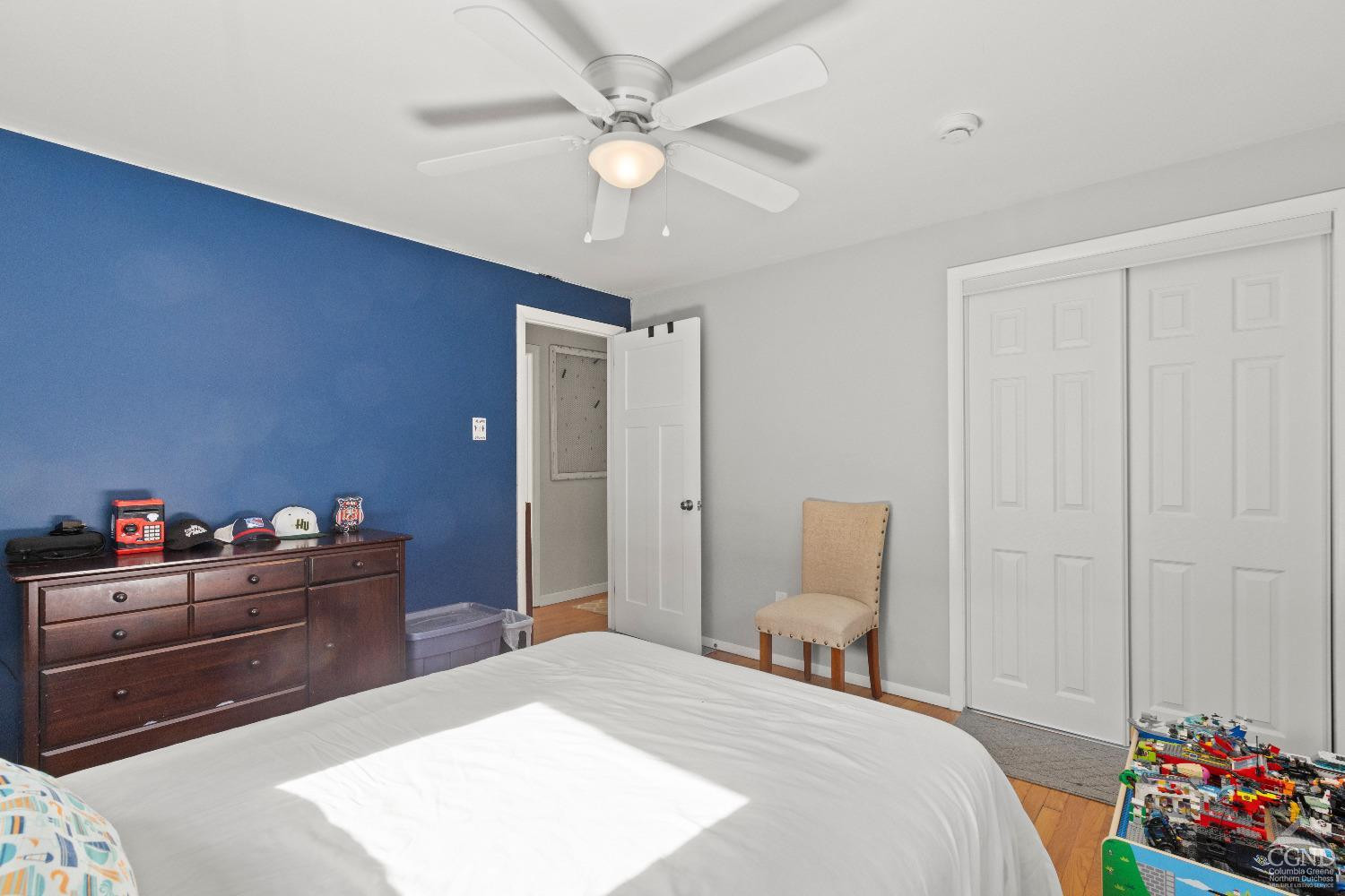 7 Red Apple Lane Catskill, NY 12414 - Photo 18 of 32 a bedroom with a bed and a chandelier