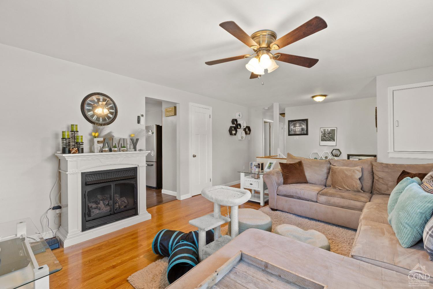 7 Red Apple Lane Catskill, NY 12414 - Photo 4 of 32 a living room with furniture a clock and a fireplace