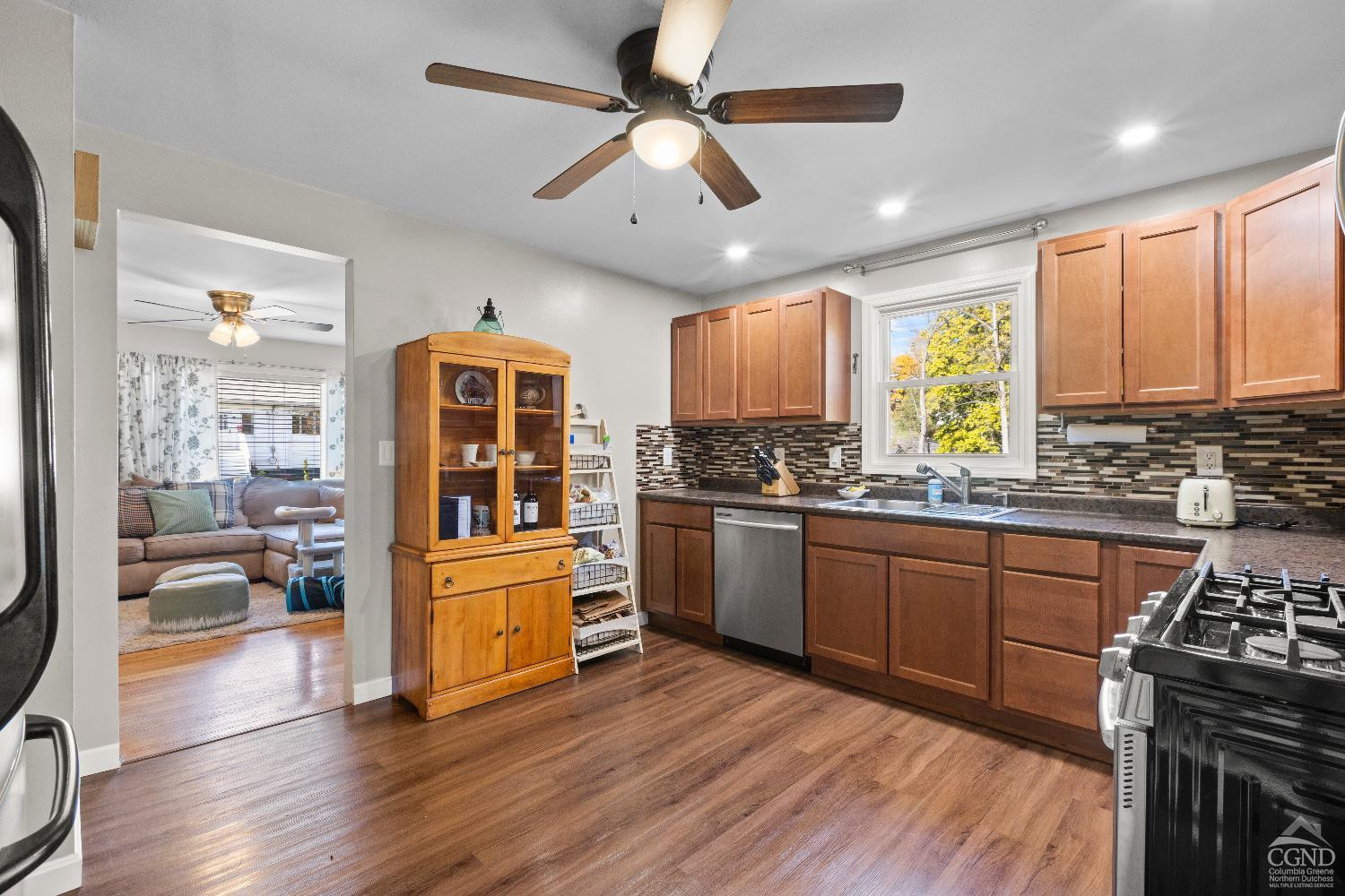 7 Red Apple Lane Catskill, NY 12414 - Photo 7 of 32 a kitchen with stainless steel appliances granite countertop a stove cabinets and wooden floor