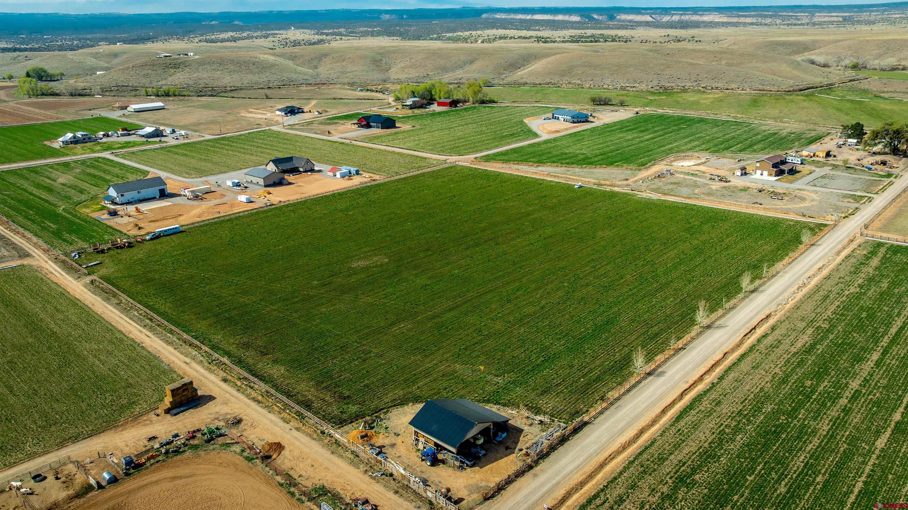 Lot 3 Jefferson Road Montrose, CO 81403 - Photo 19 of 24 a view of a golf course with a lake