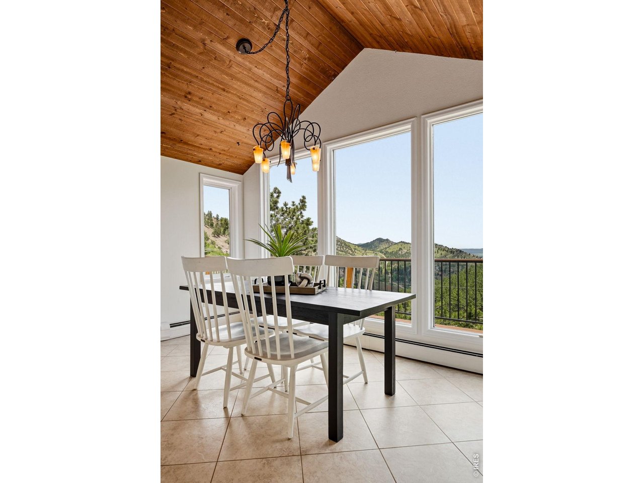 607 North Cedar Brook Road Boulder, CO 80304 - Photo 13 of 36 Arched ceilings over the dining space with floor-to-ceiling views