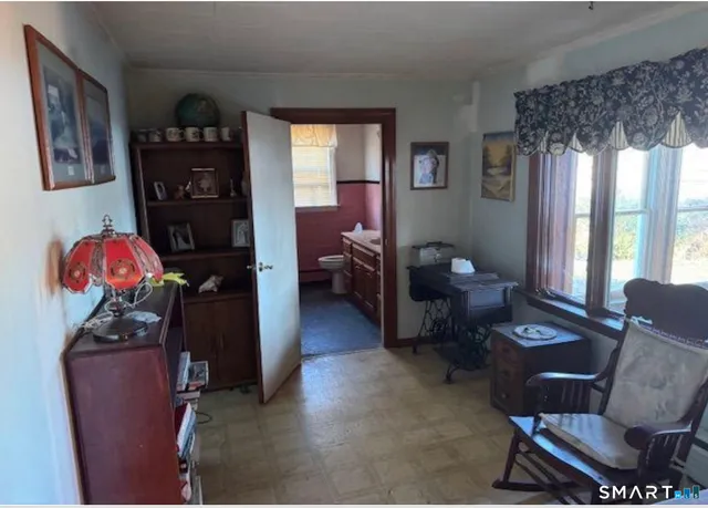 a living room with furniture and a window