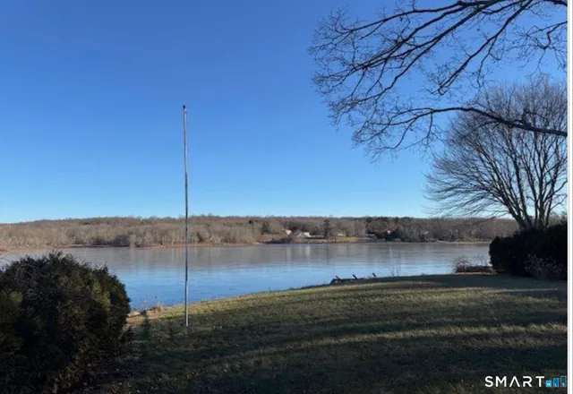 a view of a lake with a big yard