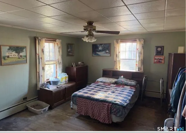 a bedroom with a bed and dresser