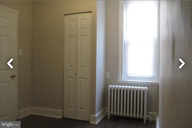 a view of a bathroom with wooden floor