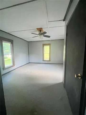 a view of empty room with windows