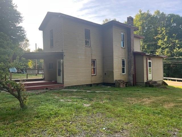 1247 Walnut Street Stoneboro, PA 16153 - Photo 2 of 18 a backyard of a house with table and chairs
