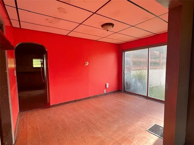 a view of a room with a bed