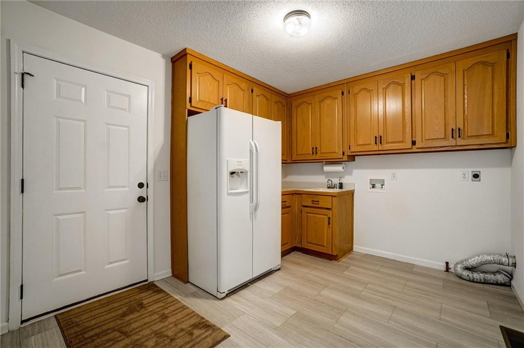 701 Longview Street Canton, GA 30114 - Photo 8 of 18 a view of a storage and utility room with wooden floor