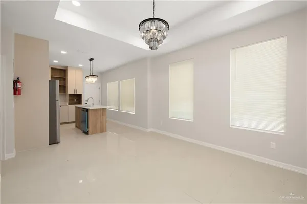 a view of a kitchen with a sink and cabinet area
