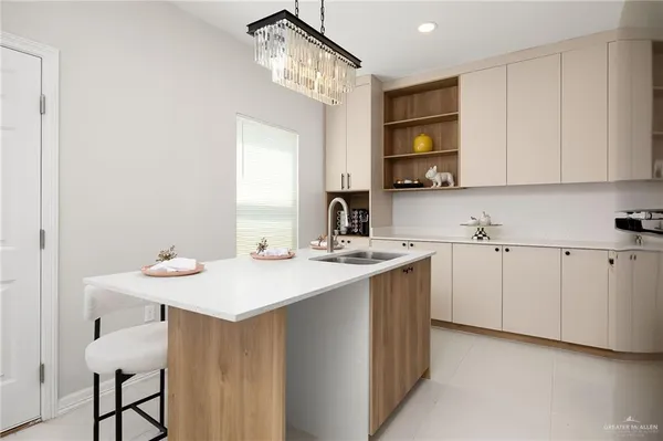 a kitchen with a sink and cabinets