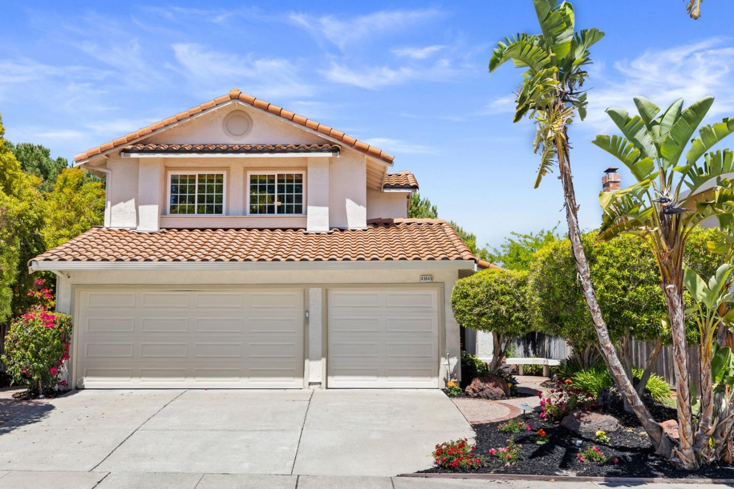 43643 Skye Road Fremont, CA 94539 - Photo 2 of 16 a front view of a house with a garage