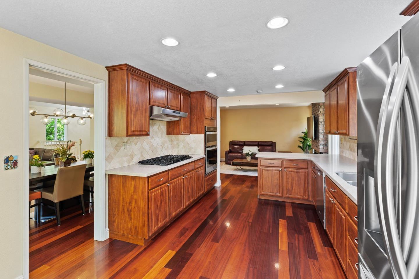 43643 Skye Road Fremont, CA 94539 - Photo 7 of 16 a kitchen with stainless steel appliances granite countertop a stove and a refrigerator