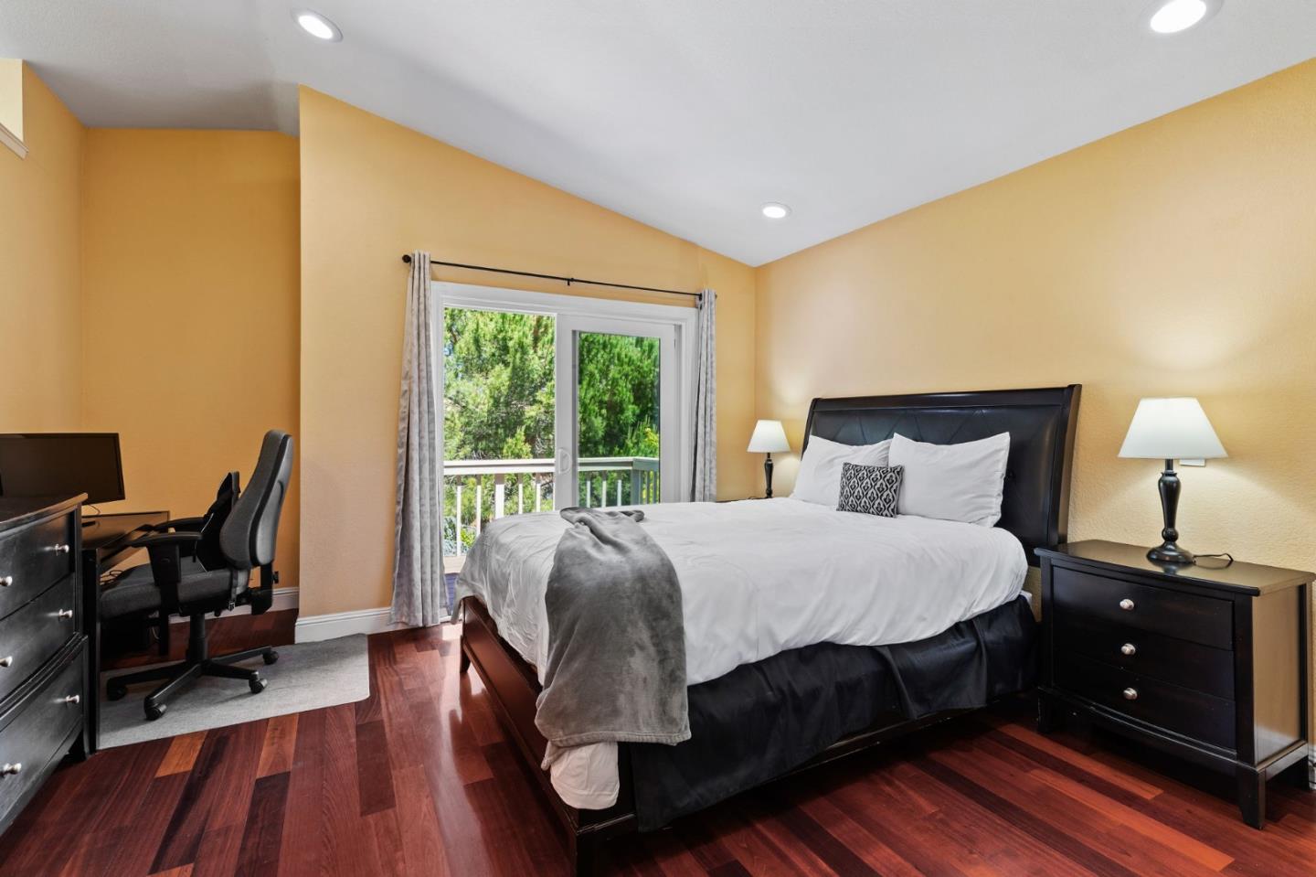 43643 Skye Road Fremont, CA 94539 - Photo 9 of 16 a bedroom with a bed and wooden floor