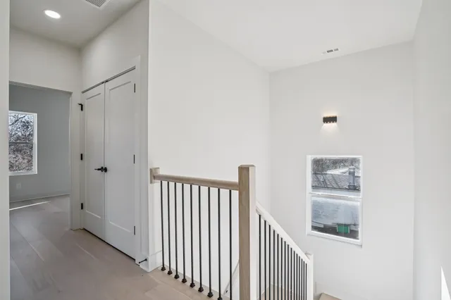 a view of a hallway with windows