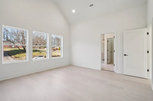 an empty room with windows